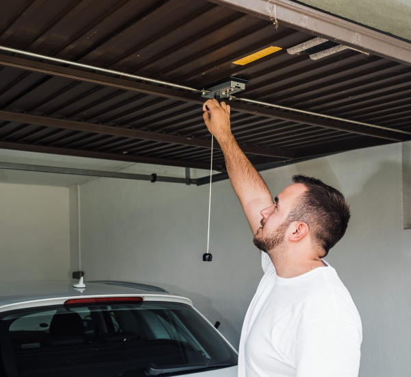 Straightening a bent garage door track after the door jumped its rails