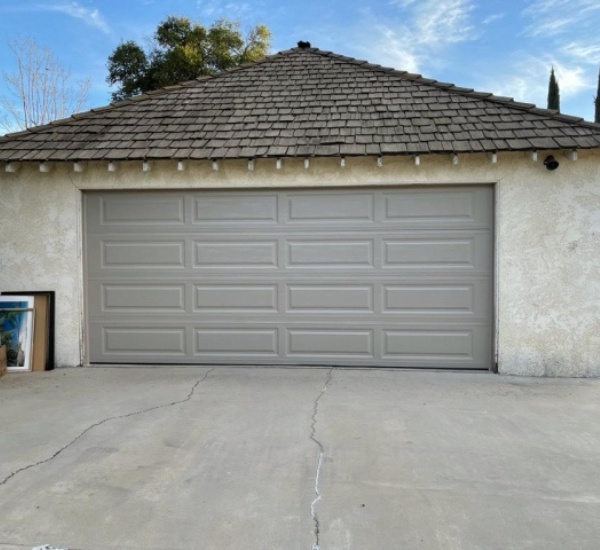 Garage door track alignment service restoring smooth travel on a frequently used door