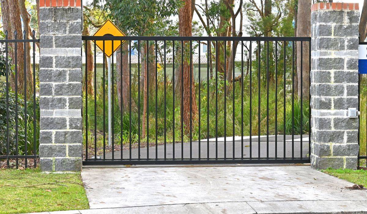 Driveway gate repair and pricing consultation at a Los Angeles home