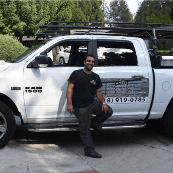 EM Garage Doors installation technicians at a Los Angeles job site