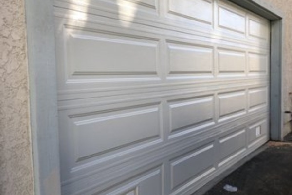 Roller lubrication and hardware check during a garage door tune-up