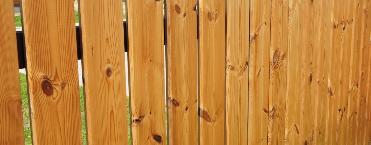 Repairing a contemporary wooden gate to restore its original beauty and function.