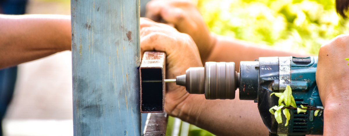 Custom-designed gates being repaired by skilled technicians in Los Angeles.