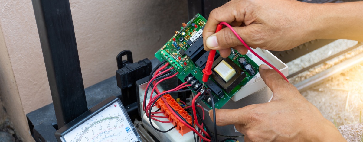 Professional gate repair specialist working on a custom gate in Los Angeles.