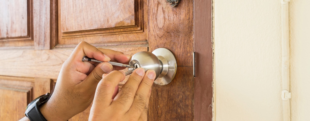 A professional installing a new gate opener in a Los Angeles home.